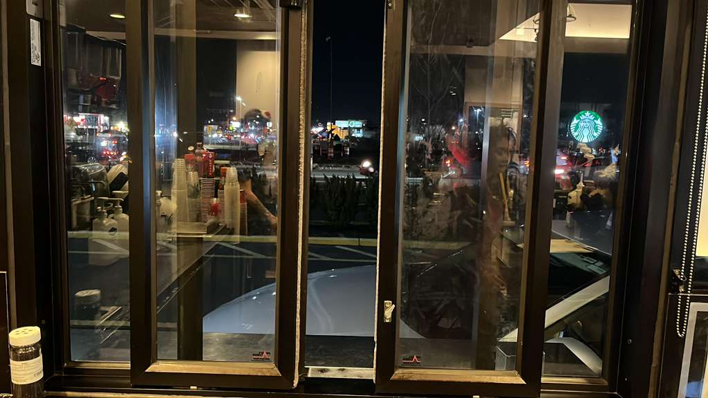 Storefront glass at night after service call.